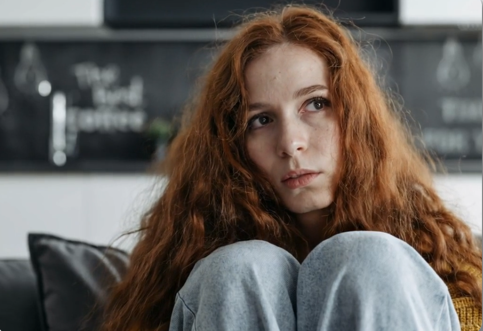 couple facing away from each other looking stressed, relationship tension, emotional distance, professional photography, muted colors